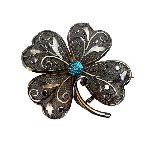 242 - ORNATE 4 LEAF CLOVER BROOCH SET WITH BLUE STONES 2X2