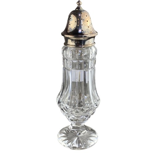 302 - A CUT GLASS SUGAR SHAKER WITH HALLMARKED SILVER TOP 8.5