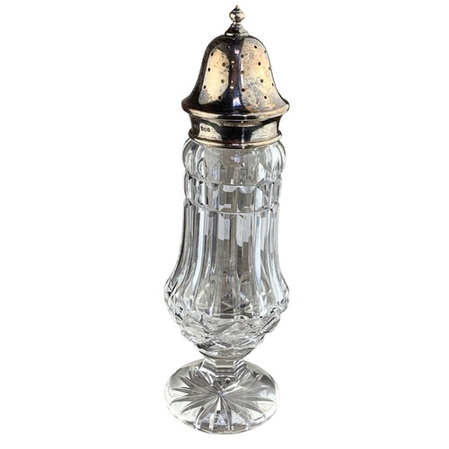 302 - A CUT GLASS SUGAR SHAKER WITH HALLMARKED SILVER TOP 8.5