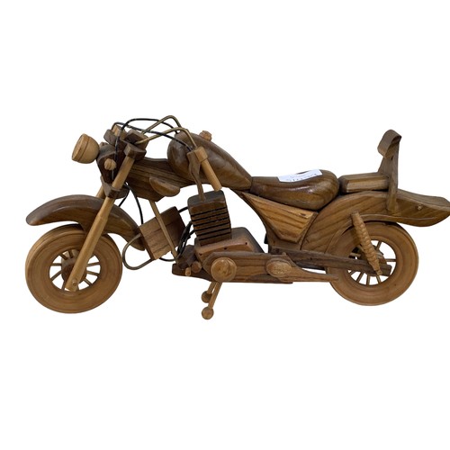 401 - A HAND CARVED WOODEN MOTORBIKE