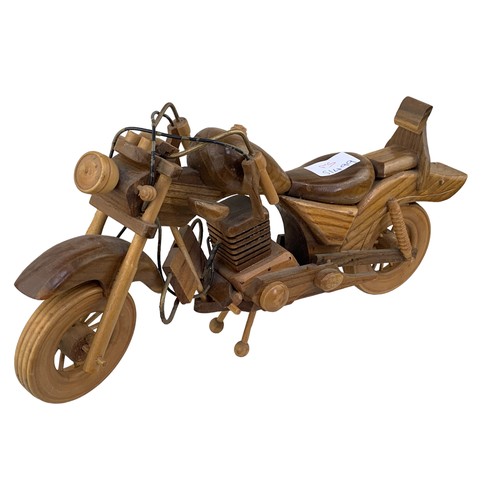 401 - A HAND CARVED WOODEN MOTORBIKE