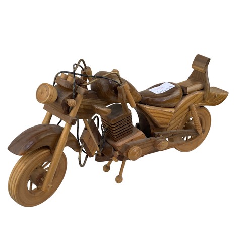 401 - A HAND CARVED WOODEN MOTORBIKE