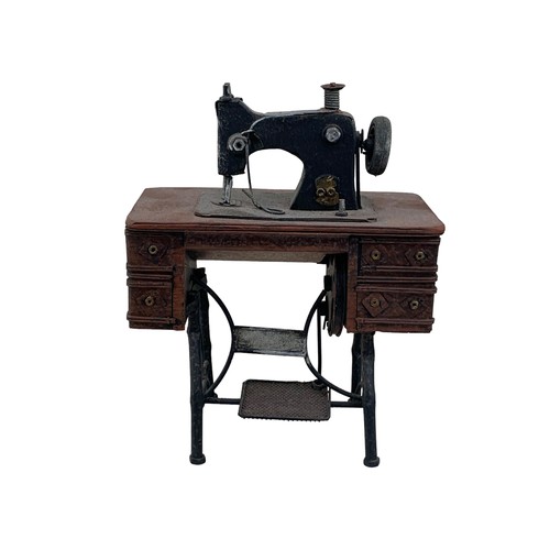 404 - A MINITURE TABLE SEWING MACHINE (ORNAMENTAL)