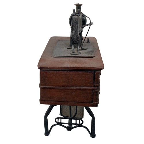 404 - A MINITURE TABLE SEWING MACHINE (ORNAMENTAL)