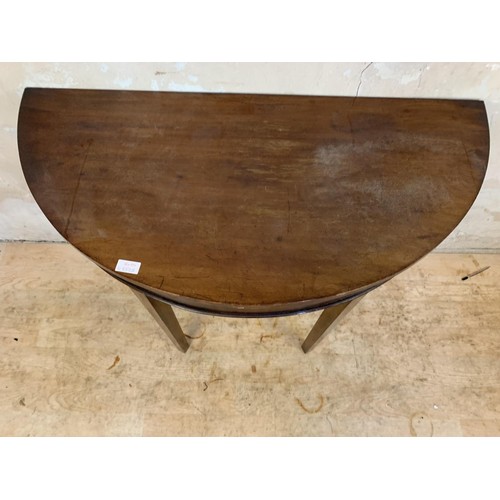 1 - AN ANTIQUE MAHOGANY DEMI-LUNE TABLE 39 x 19