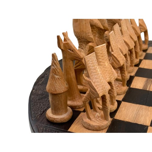 83 - A CARVED AFRICAN (KENYA) CHESS SET