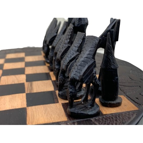 83 - A CARVED AFRICAN (KENYA) CHESS SET