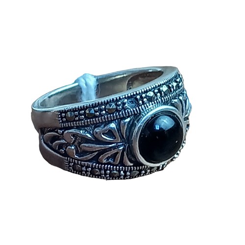 210 - AN ORNATE SILVER AND MARCASITE JET SET RING