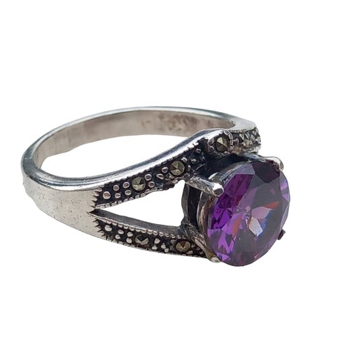 219 - A SILVER MARCASITE AND AMETHYST RING (BOXED)