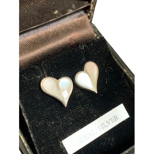 251 - A SILVER HEART SHAPED MOTHER OF PEARL SET EARRINGS