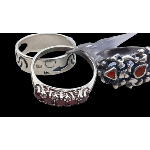 299 - 3 SILVER RINGS....1 BAND 1 GARNET AND 3 STONE 11.1gms