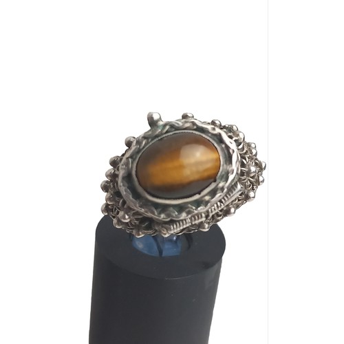 302 - VERY ORNATE SILVER RING WITH TIGER EYES