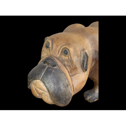 100A - A SOLID WOODEN BULL DOG FIGURINE