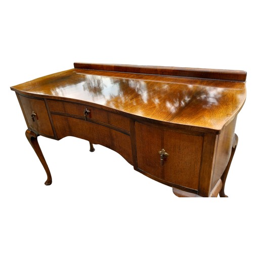 36 - A SHAPED CAB LEGGED DRESSING TABLE