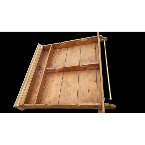 36 - AN ANTIQUE PINE PLATE RACK WITH BRASS RAIL