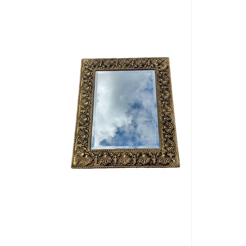 115 - AN ORNATE GILT FRAMED BEVELL EDGE MIRROR 18X22