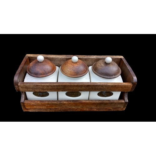 74 - TEA,COFFEE,SUGAR CADDIES IN WALL MOUNT RACK