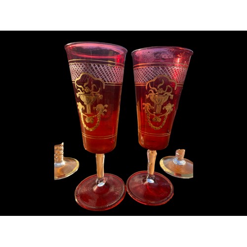 102 - A PAIR OF RUBY GLASS HAND PAINTED SPILL VASE AND 2 GILT OVERLAY RUBY VASE