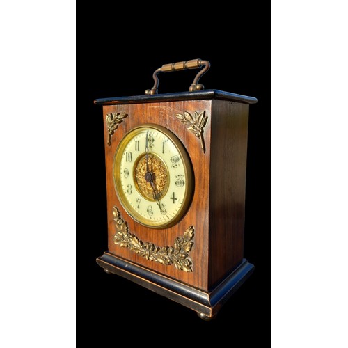 141 - AN OAK MANTLE CLOCK WITH BRASS MOUNTS & BEVELLED GLASS 7