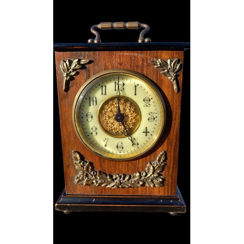 141 - AN OAK MANTLE CLOCK WITH BRASS MOUNTS & BEVELLED GLASS 7