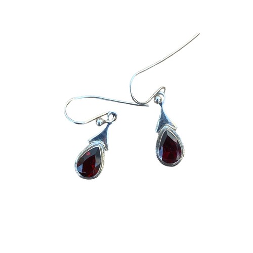 240 - A PAIR OF GARNET SET SILVER EARRINGS