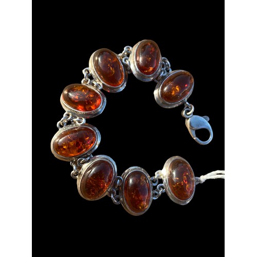 262 - A SILVER AND AMBER BRACELET