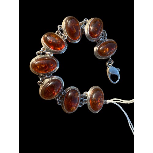 262 - A SILVER AND AMBER BRACELET