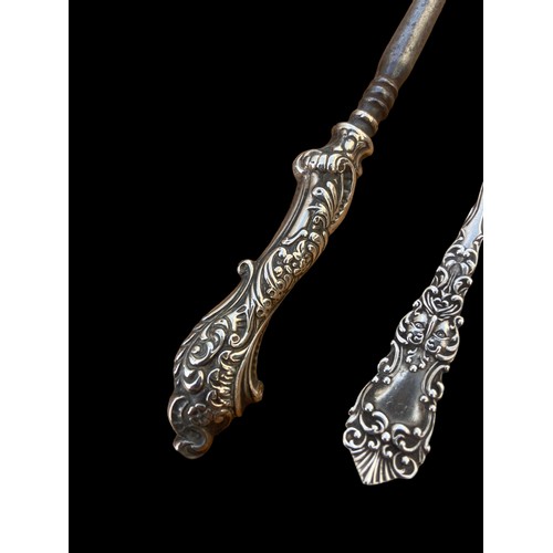 264 - A SILVER HANDLED BUTTON AND AN ORNATE SILVER PASTRY FORK