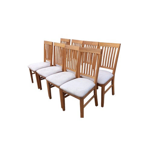 109 - A SET OF 8 OAK DINING CHAIRS WITH FABRIC SEATS