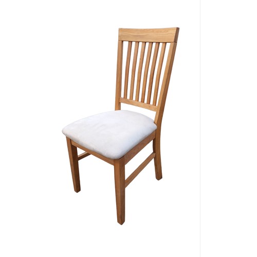 109 - A SET OF 8 OAK DINING CHAIRS WITH FABRIC SEATS