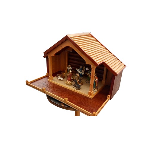 147 - A GOOD QUALITY NATIVITY SET WITH A LIGHT UP MANGER