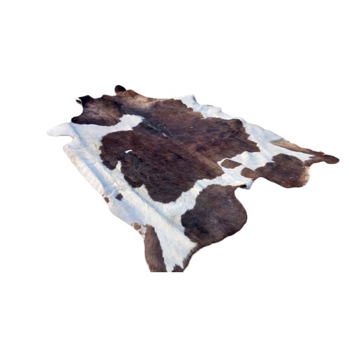 384 - A LARGE ANIMAL HIDE RUG