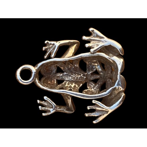 567 - A HEAVY ORNATE SILVER FROG PENDANT