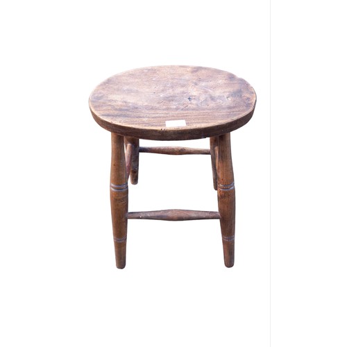 459 - AN ANTIQUE OVAL TOPPED TURNED LEG STOOL