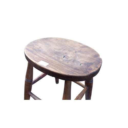 459 - AN ANTIQUE OVAL TOPPED TURNED LEG STOOL