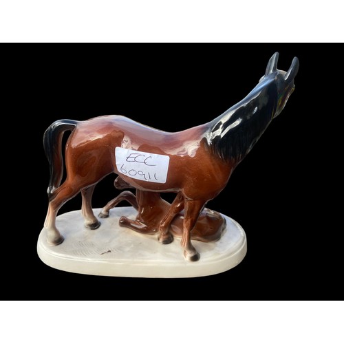 466 - A POTTERY GLAZED HORSE & FOAL MARKINGS TO BASE 7