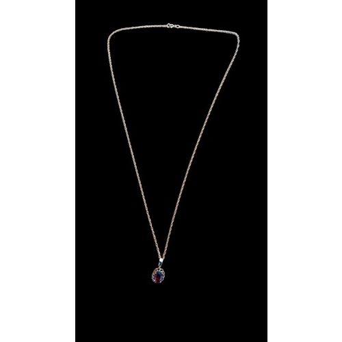 582 - A 9ct GOLD PENDANT GARNET STONE ON 9ct GOLD CHAIN