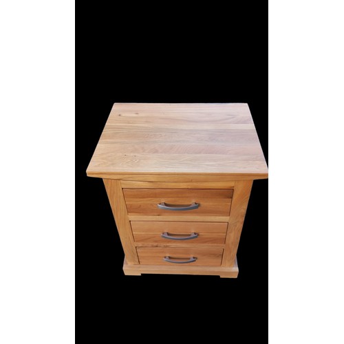 520 - AN OAK 3 DRAWER BEDSIDE 15 x 19 x 23.5