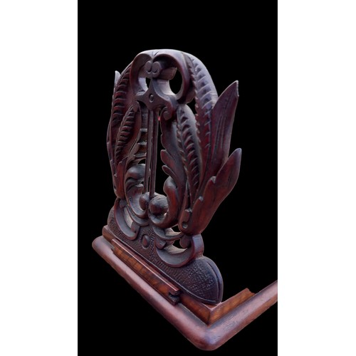 796 - A BEAUTIFULLY CARVED ANTIQUE WALNUT BOOKSLIDE