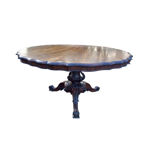 545 - A STUNNING  VICTORIAN ROSEWOOD DINING TABLE WITH A SHAPED EDGE ON A VERY ORNATE TRIPOD BASE 53