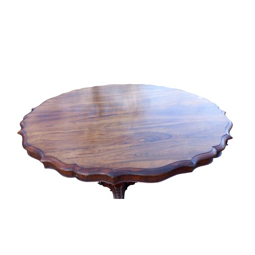 545 - A STUNNING  VICTORIAN ROSEWOOD DINING TABLE WITH A SHAPED EDGE ON A VERY ORNATE TRIPOD BASE 53