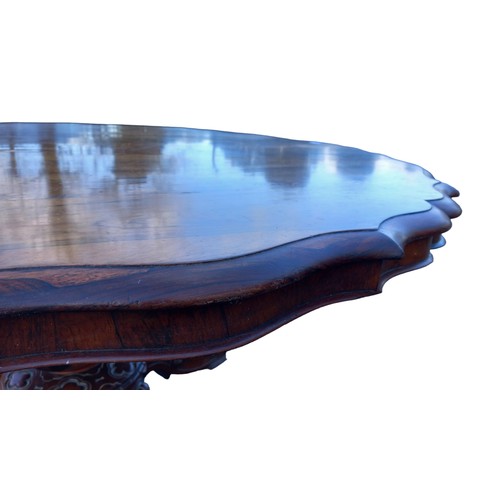 545 - A STUNNING  VICTORIAN ROSEWOOD DINING TABLE WITH A SHAPED EDGE ON A VERY ORNATE TRIPOD BASE 53