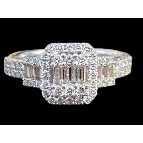 659 - AN 18ct GOLD AND MULTI DIAMOND RING