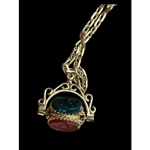 612 - A 9CT GOLD FANCY LINK CHAIN WITH AN ORNATE SWIVEL FOB SET WITH CORNELIAN, JET & GOLDSTONE