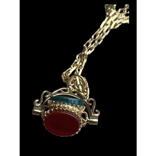 612 - A 9CT GOLD FANCY LINK CHAIN WITH AN ORNATE SWIVEL FOB SET WITH CORNELIAN, JET & GOLDSTONE