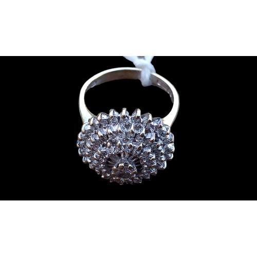 667 - A DIAMOND CLUSTER RING WITH DIAMOND TO CENTRE TOP WITH 3 OUTER ROWS SURROUNDING SET IN WHITE GOLD  O... 