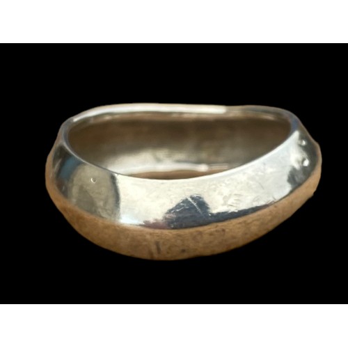 752 - A SHAPED HEAVY SILVER RING