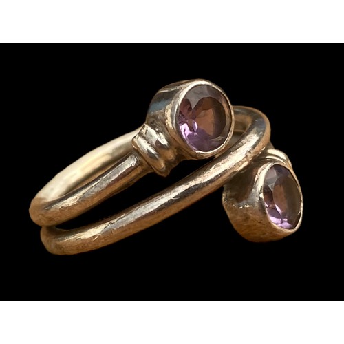 762 - A STUNNING MUTLI BAND SILVER RING SET WITH 2 AMETHYST STONES