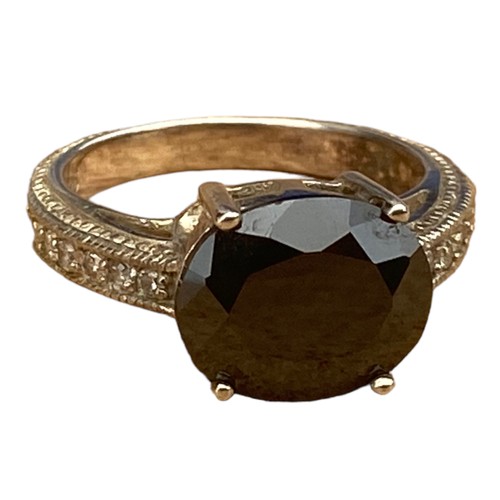 775 - A DESIGNER ORNATE BAND SILVER RING WITH DARK TOPAZ STONE WITH A GEM SET SHOULDER