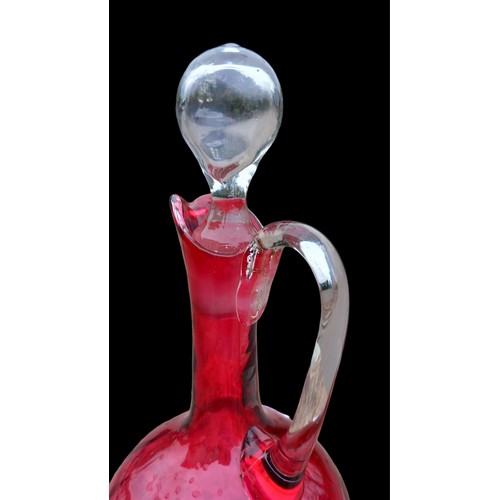 792 - A CLEAR GLASS HANDLE & STOPPER RUBY GLASS EWER